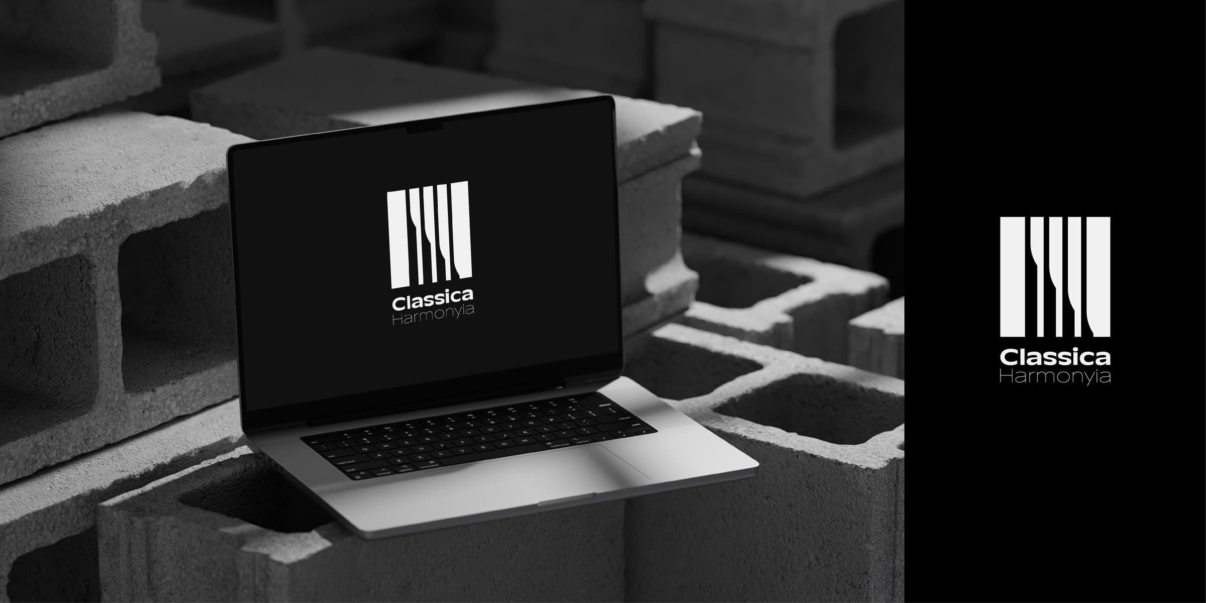 Logo on a laptop in a dark concrete scene